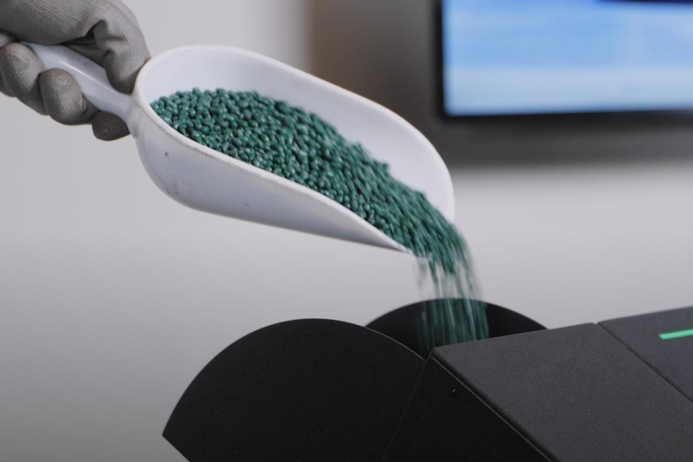 Thermoplastic pellets loaded into a pellet printer hopper
